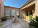 Private courtyard featuring a decorative fountain and lush greenery at 4565 Riva De Romanza St, Las Vegas, NV 89135