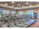 Well-equipped fitness center showcasing modern treadmills, carpeted floors, and large windows for a bright workout space at 4565 Riva De Romanza St, Las Vegas, NV 89135