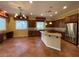 Bright and open kitchen with granite countertops, stainless steel appliances, and large island at 4565 Riva De Romanza St, Las Vegas, NV 89135
