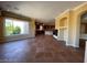 The living room is open to the kitchen area with fireplace and natural light at 4565 Riva De Romanza St, Las Vegas, NV 89135