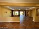 Open-concept living space with decorative columns and sliding glass doors to the backyard at 4565 Riva De Romanza St, Las Vegas, NV 89135