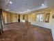 Expansive living room with decorative lighting and tile floors at 4565 Riva De Romanza St, Las Vegas, NV 89135