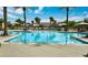 Beautiful pool area with lounge chairs and palm trees, offering a resort-style experience at 4565 Riva De Romanza St, Las Vegas, NV 89135