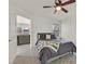 Cozy bedroom features a ceiling fan, plush carpeting, and natural light from the window at 5055 W Hacienda Ave # 1136, Las Vegas, NV 89118