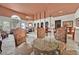 A spacious dining room with elegant decor, featuring a glass-topped table, ornate chairs, and access to the living room at 5055 W Hacienda Ave # 1136, Las Vegas, NV 89118