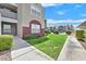 Well-maintained condo building featuring lush landscaping and convenient walkway access at 5055 W Hacienda Ave # 1136, Las Vegas, NV 89118