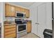 Modern kitchen with stainless steel appliances and ample cabinet space, perfect for cooking and storage at 5055 W Hacienda Ave # 1136, Las Vegas, NV 89118