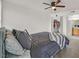 Cozy primary bedroom with a ceiling fan, spacious closet, and easy access to ensuite bath at 5055 W Hacienda Ave # 1136, Las Vegas, NV 89118
