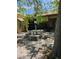 Lush backyard retreat with stone table and benches, ideal for outdoor gatherings and relaxation at 5305 Bright Sun Ct, Las Vegas, NV 89130