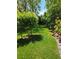 Lush backyard with green grass and mature trees, perfect for outdoor enjoyment and relaxation at 5305 Bright Sun Ct, Las Vegas, NV 89130