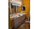 Bright bathroom with a double sink vanity, large mirror, and overhead lighting at 5305 Bright Sun Ct, Las Vegas, NV 89130