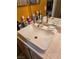 Close up view of the bathroom sink with chrome faucet, and tiled countertop at 5305 Bright Sun Ct, Las Vegas, NV 89130