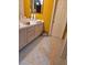 Bathroom with double vanity, tile flooring and yellow walls at 5305 Bright Sun Ct, Las Vegas, NV 89130