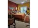 Eclectic bedroom with unique color scheme, furniture, and décor at 5305 Bright Sun Ct, Las Vegas, NV 89130