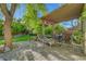 Serene covered patio with comfortable seating, perfect for outdoor relaxation and entertaining at 5305 Bright Sun Ct, Las Vegas, NV 89130
