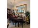 Elegant dining room features dark wood furniture, a decorative chandelier, and a large mirror at 5305 Bright Sun Ct, Las Vegas, NV 89130