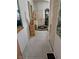 Hallway with tile floors, decorative statues, and a door to the adjacent living area at 5305 Bright Sun Ct, Las Vegas, NV 89130
