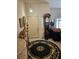Welcoming entryway with decorative rug, tiled floors, complemented by a grandfather clock and statuettes at 5305 Bright Sun Ct, Las Vegas, NV 89130