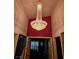 Stunning foyer featuring a sparkling, tiered crystal chandelier at 5305 Bright Sun Ct, Las Vegas, NV 89130