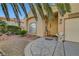 Inviting home featuring unique stonework, desert landscaping, and a charming front entrance at 5305 Bright Sun Ct, Las Vegas, NV 89130