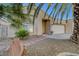 Charming home with a beautifully landscaped front yard, featuring desert landscaping and decorative stonework at 5305 Bright Sun Ct, Las Vegas, NV 89130