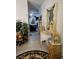 Inviting hallway with tile floors, decorative statues, and ornate furnishings at 5305 Bright Sun Ct, Las Vegas, NV 89130