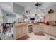 Bright kitchen features a breakfast bar, custom mural, granite counters, and modern stainless appliances at 5305 Bright Sun Ct, Las Vegas, NV 89130
