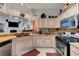 Bright kitchen features a breakfast bar, granite counters, stainless appliances, and adjacent dining area at 5305 Bright Sun Ct, Las Vegas, NV 89130