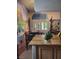 Eat-in kitchen with granite countertops and view of European cafe mural at 5305 Bright Sun Ct, Las Vegas, NV 89130