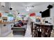 Spacious living area featuring a bar, comfortable seating, and decorative murals at 5305 Bright Sun Ct, Las Vegas, NV 89130