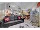 Living room with murals, comfortable seating and a decorative bird cage at 5305 Bright Sun Ct, Las Vegas, NV 89130