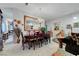 Spacious living and dining room with neutral paint and tile flooring, perfect for entertaining at 5305 Bright Sun Ct, Las Vegas, NV 89130