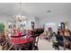 Formal living room with elegant chandelier, large table, and comfortable seating area at 5305 Bright Sun Ct, Las Vegas, NV 89130