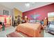 Bright primary bedroom with unique wall design, neutral carpet, and comfortable furnishings at 5305 Bright Sun Ct, Las Vegas, NV 89130