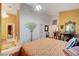 Bedroom features views of hallway, uniquely painted walls, and modern ceiling fan at 5305 Bright Sun Ct, Las Vegas, NV 89130