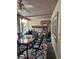 Relaxing covered patio with ceiling fan, outdoor furniture, and charming decor for easy outdoor living at 5305 Bright Sun Ct, Las Vegas, NV 89130