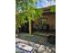 Charming covered patio features dining area, built in grill, and ample space for outdoor enjoyment at 5305 Bright Sun Ct, Las Vegas, NV 89130
