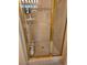 Enclosed shower stall with a gold frame and tiled walls at 5305 Bright Sun Ct, Las Vegas, NV 89130