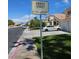 Street view with a private street sign, houses, and parked cars at 5305 Bright Sun Ct, Las Vegas, NV 89130
