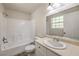 Bathroom featuring a shower-tub combo, a vanity with sink, and a window for natural light at 5330 E Charleston Blvd # 28, Las Vegas, NV 89142