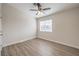 Clean, light-filled bedroom with wood-look flooring and a ceiling fan at 5330 E Charleston Blvd # 28, Las Vegas, NV 89142