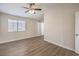 Bright bedroom with a ceiling fan, a view from the window, and durable flooring at 5330 E Charleston Blvd # 28, Las Vegas, NV 89142