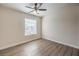 Bedroom featuring durable floors, a ceiling fan, and window at 5330 E Charleston Blvd # 28, Las Vegas, NV 89142