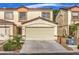 Charming townhome featuring a two-car garage and well-maintained landscaping at 5330 E Charleston Blvd # 28, Las Vegas, NV 89142
