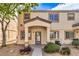 Inviting two-story exterior with covered porch and desert landscaping at 5330 E Charleston Blvd # 28, Las Vegas, NV 89142