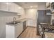 Bright kitchen featuring stainless steel appliances, ample countertop space, and wood-look floors at 5330 E Charleston Blvd # 28, Las Vegas, NV 89142