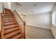 Open living area with staircase, ceiling fan, and neutral paint ready for personal touches at 5330 E Charleston Blvd # 28, Las Vegas, NV 89142