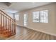 Bright living area featuring wood-look floors, natural light, and access to the outside at 5330 E Charleston Blvd # 28, Las Vegas, NV 89142