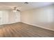 Open living area with wood-look flooring, neutral walls, and multiple entry points at 5330 E Charleston Blvd # 28, Las Vegas, NV 89142