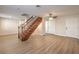 Spacious living area with wood-look flooring, open staircase, and ample natural light at 5330 E Charleston Blvd # 28, Las Vegas, NV 89142